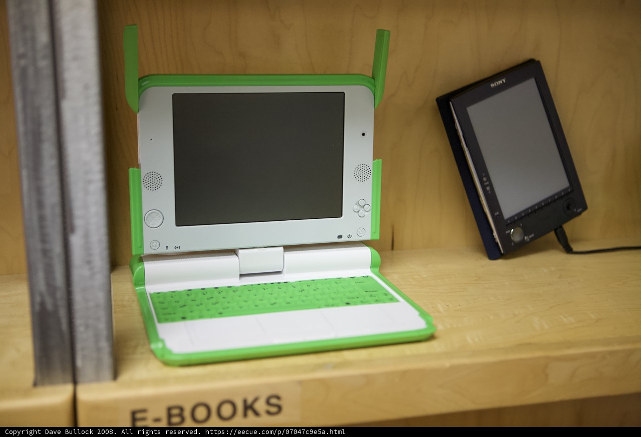 Green and White Laptop on Display