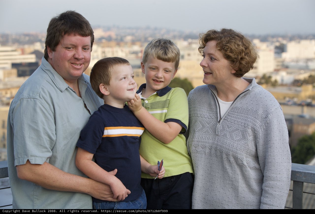Family Portrait on City Overlook at Dusk