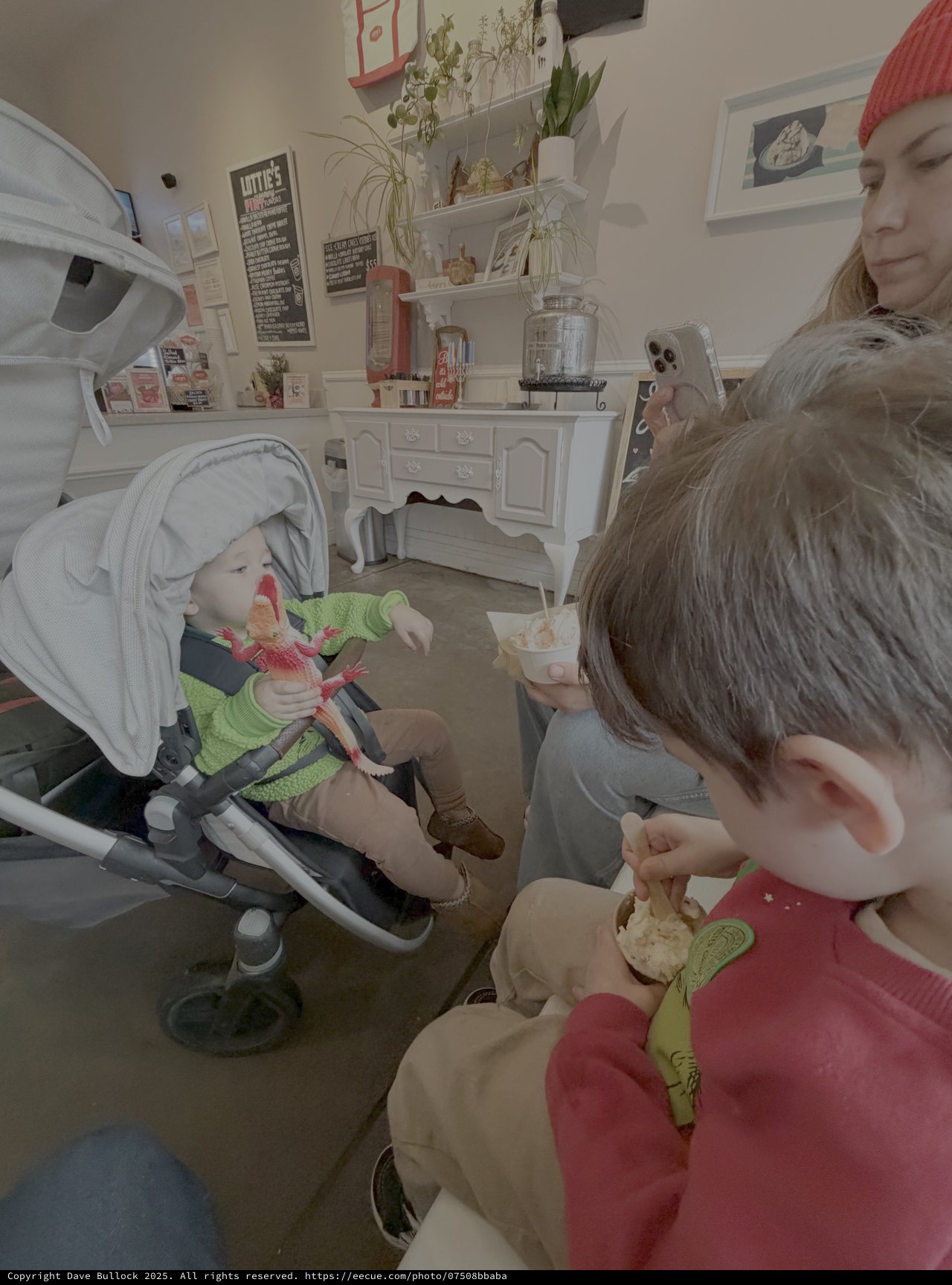 Mother and Children Enjoying Cozy Cafe Time