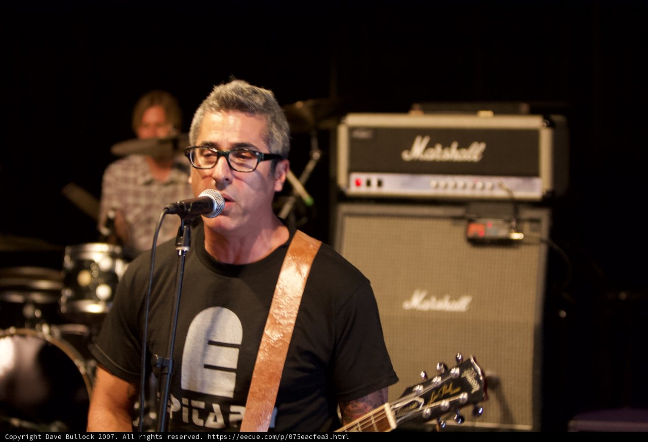 Brett Gurewitz Rocks the Stage with his Guitar and Glasses