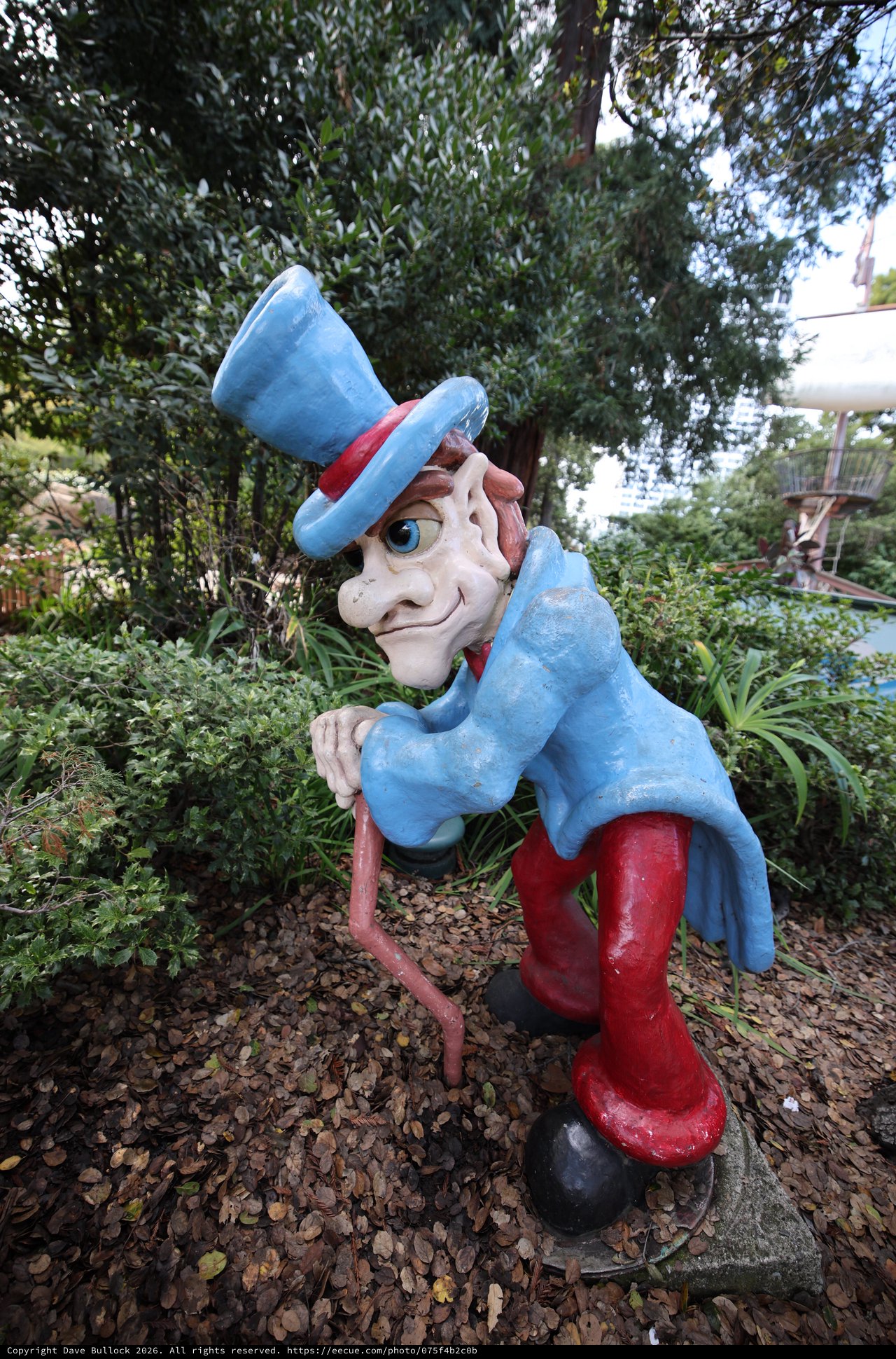 Whimsical Uncle Sam Garden Statue in Lush Setting
