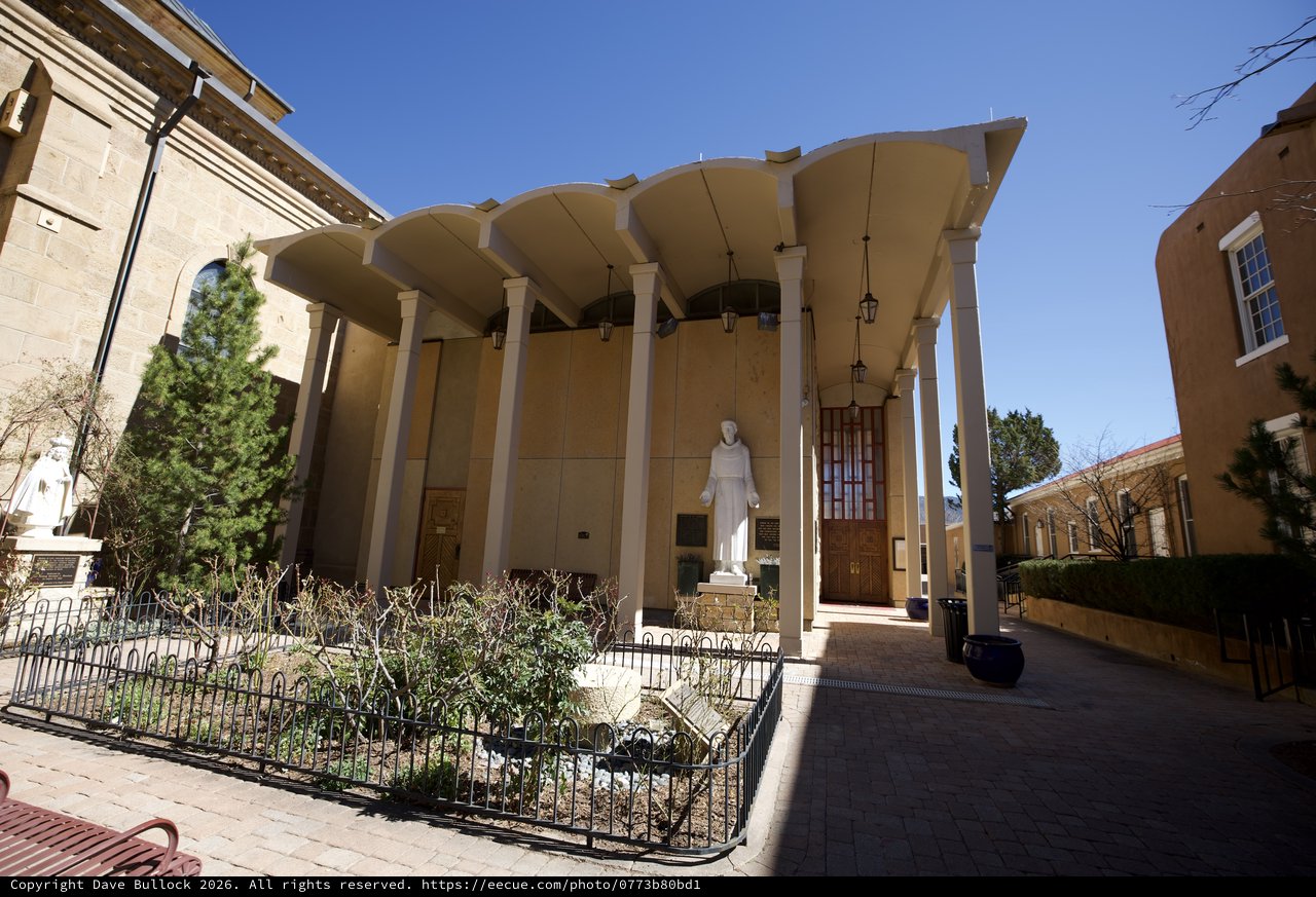 Modernist Catholic Church Entrance with Curved Canopy Architecture