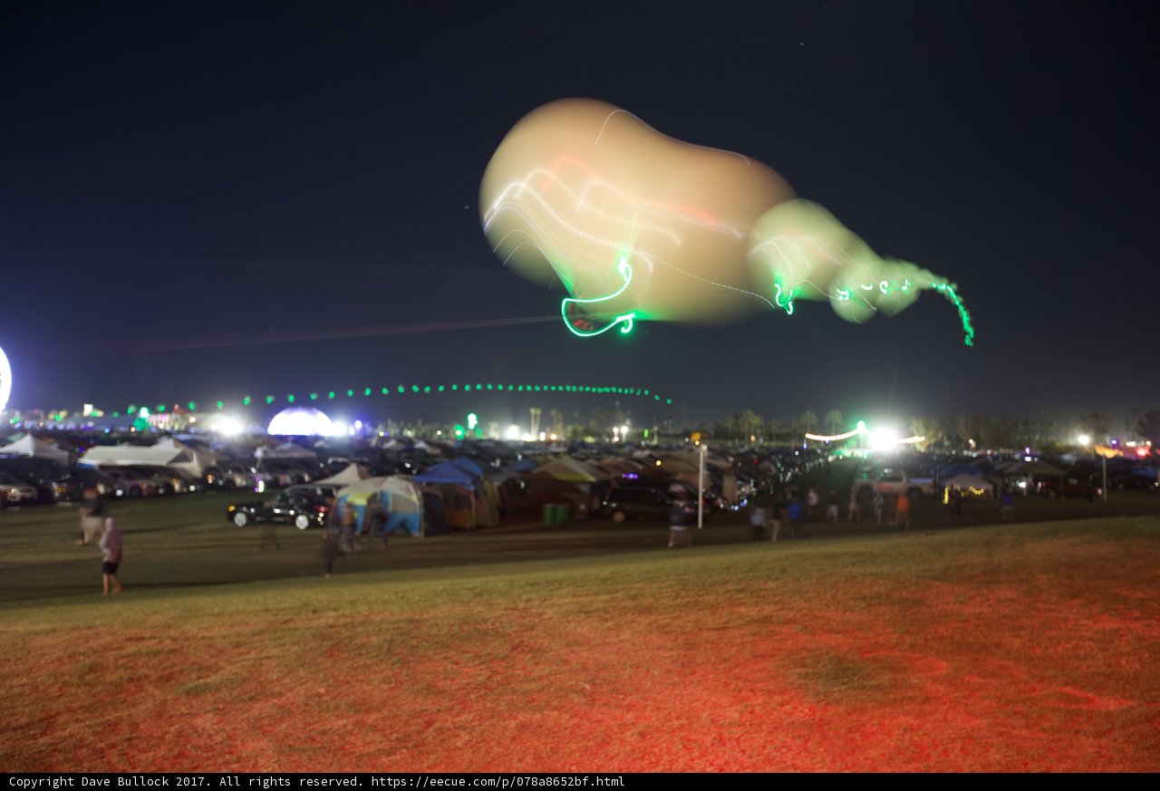 Night Kite Flying over Urban Metropolis