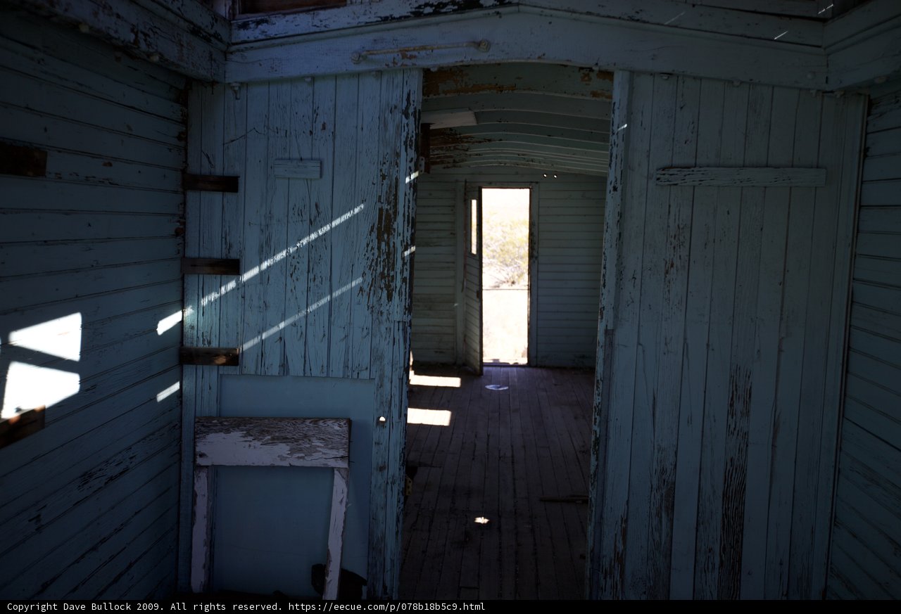 Inside View of a Rustic Train Car with Open Door