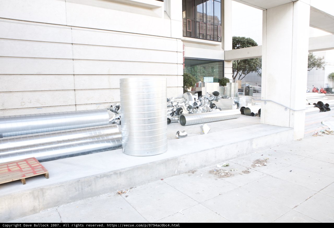Metallic Cylinder on the Sidewalk
