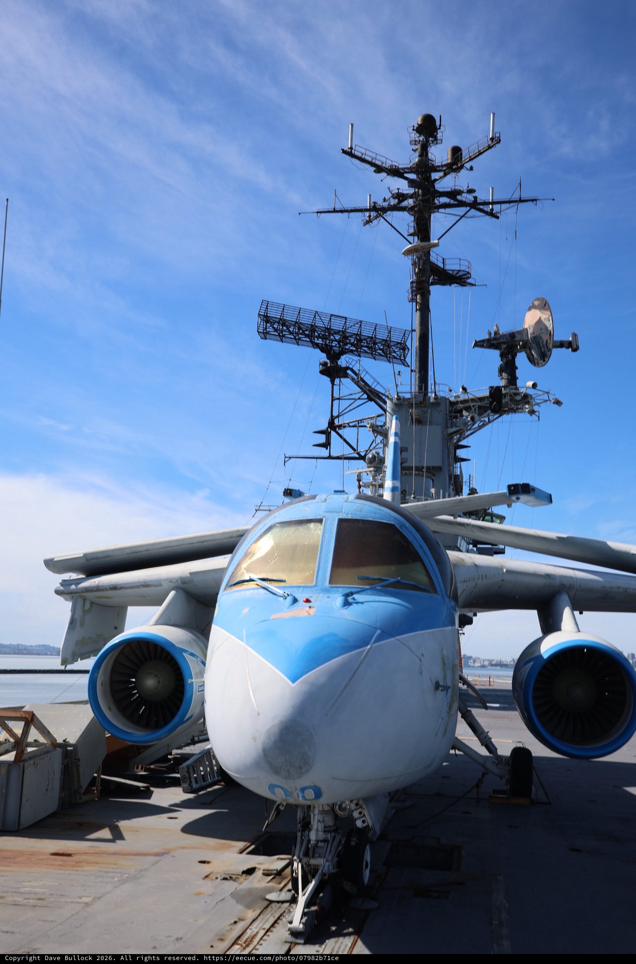 Military Aircraft on Aircraft Carrier Deck at Sunset