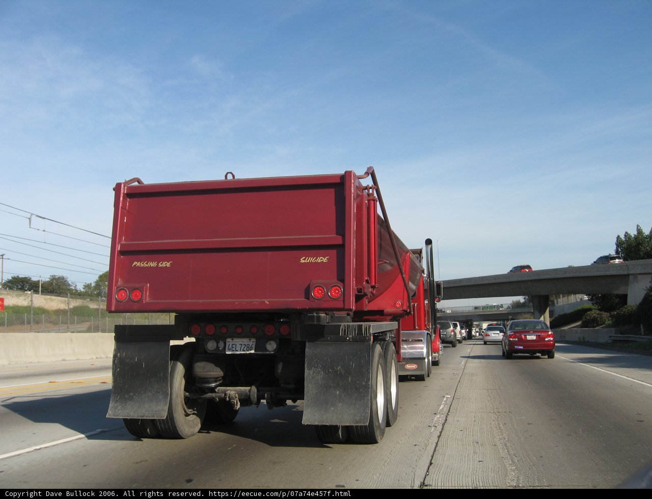 Red Dump Truck Rolling Down the Road
