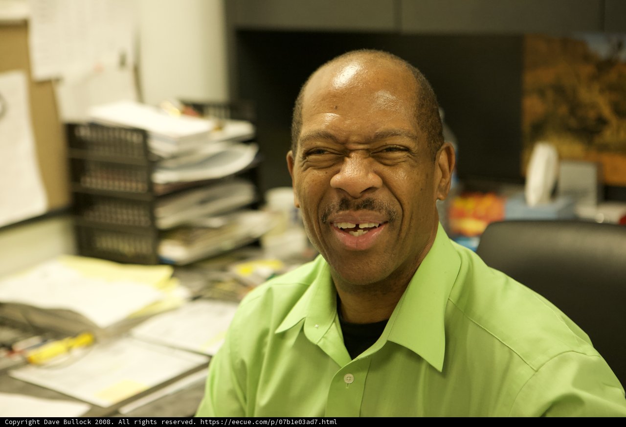 Green Shirt and A Wide Smile