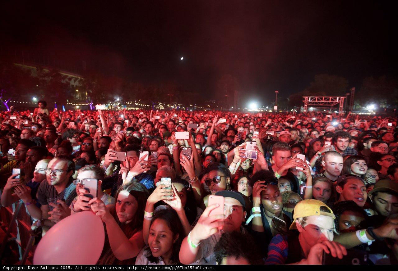 FYF Fest Wide Crowd Man Glasses Woman Sunglasses Yellow Cap Pink Balloon Moon Phones Stage Scaffolding