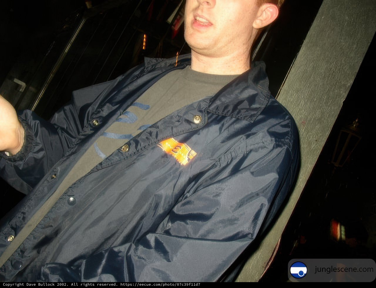 Man in a jacket controls the screen