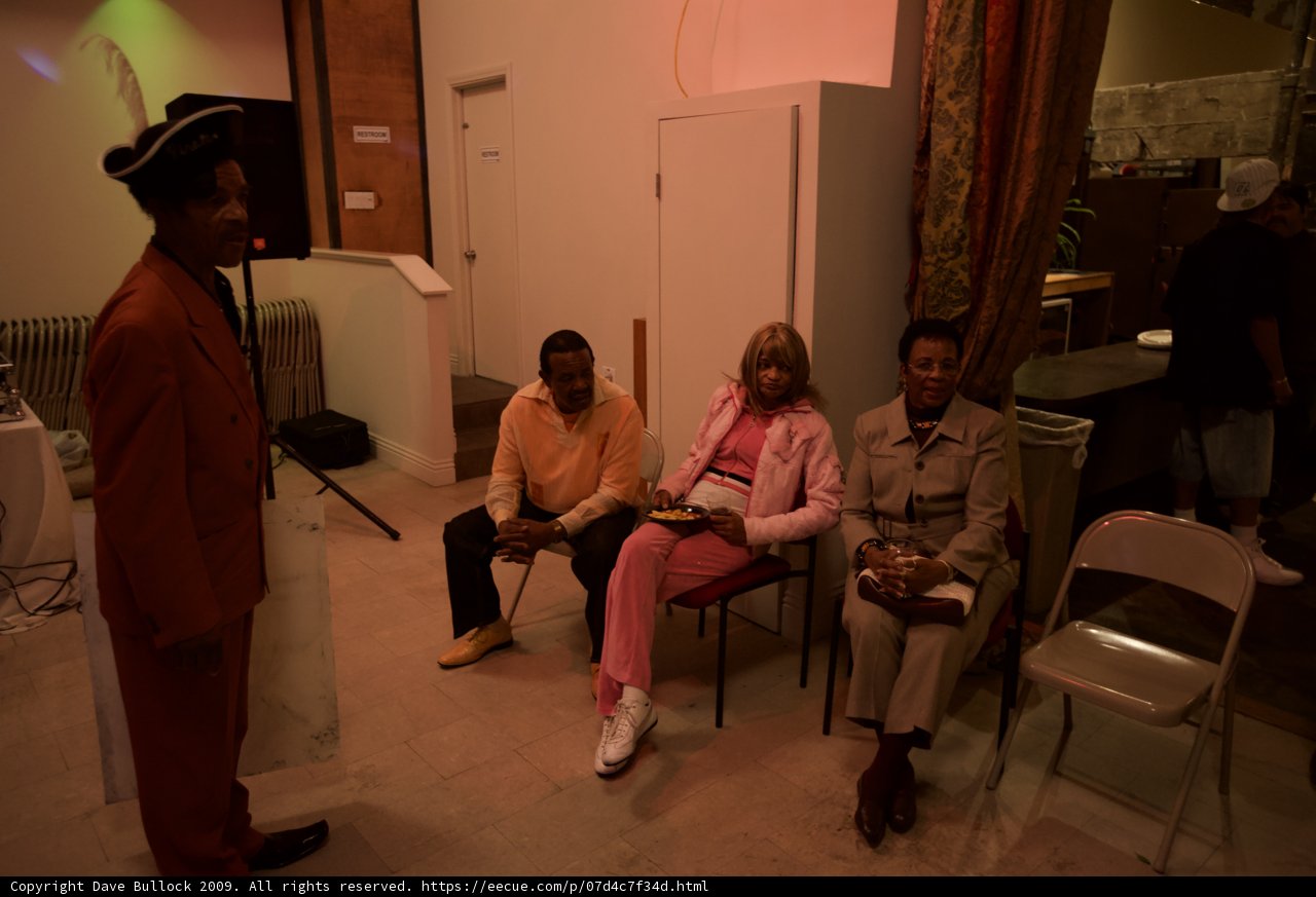 Pink Suited Freddie Stone Talks to a Group
