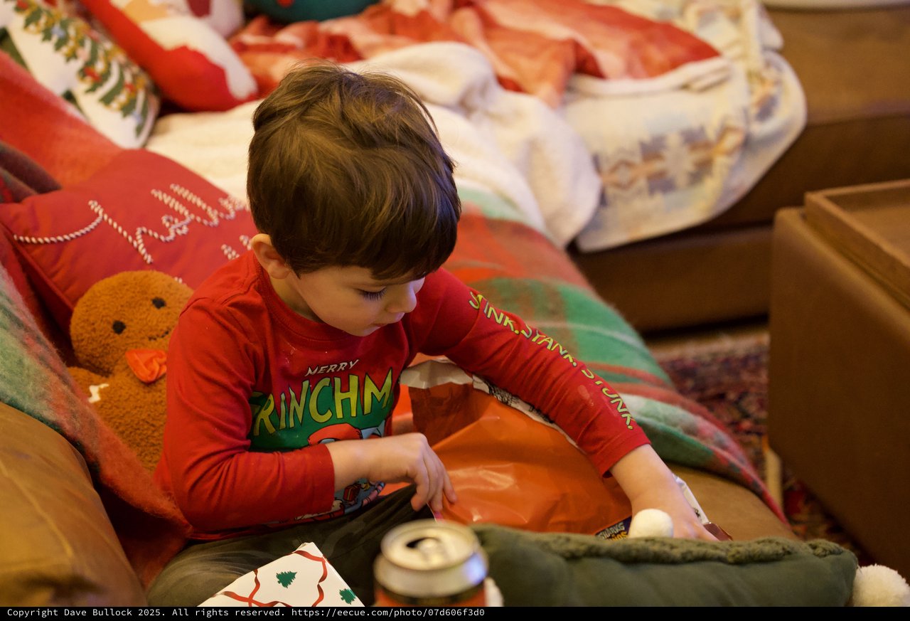Child Opening Christmas Gift on Holiday Morning