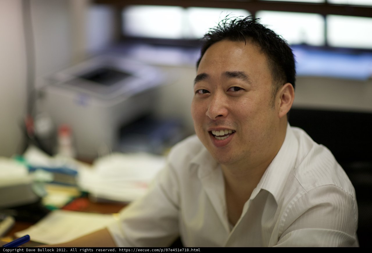 The Smiling Man at His Computer Desk
