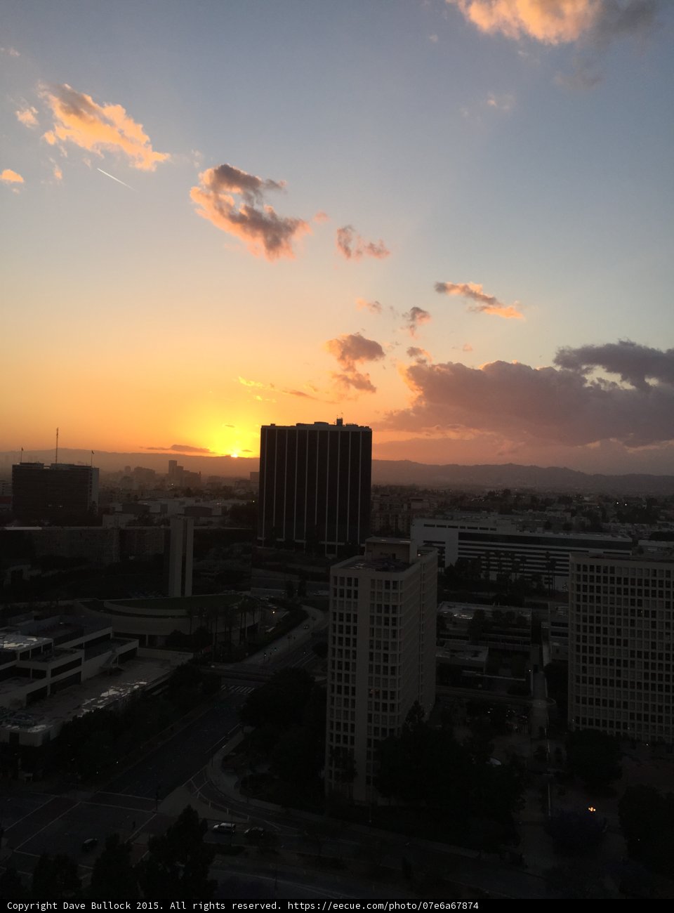 Sunset over the City Skyline from High Rise Building