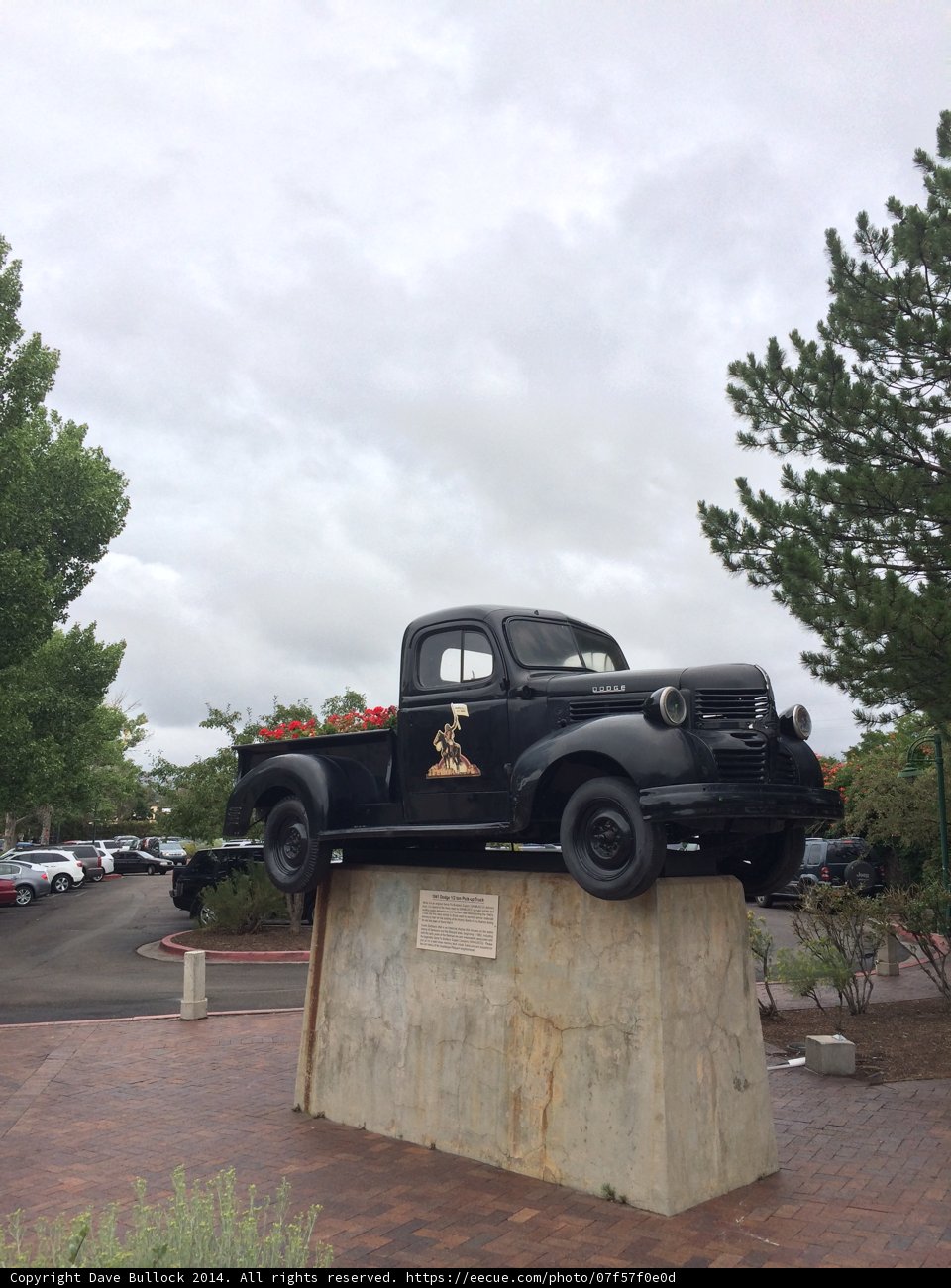 Black Pickup Truck on a Concrete Block