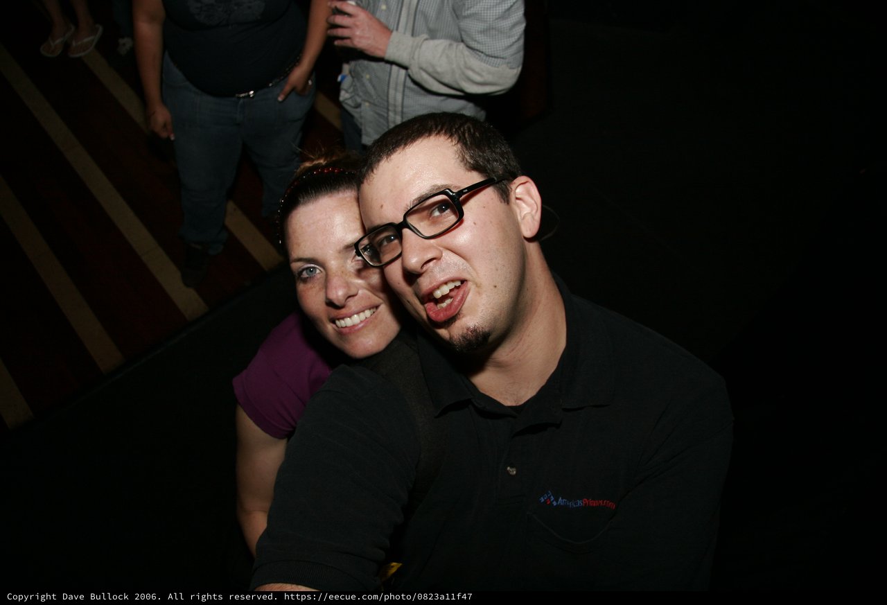 Two Friends Posing Together at a Nighttime Event