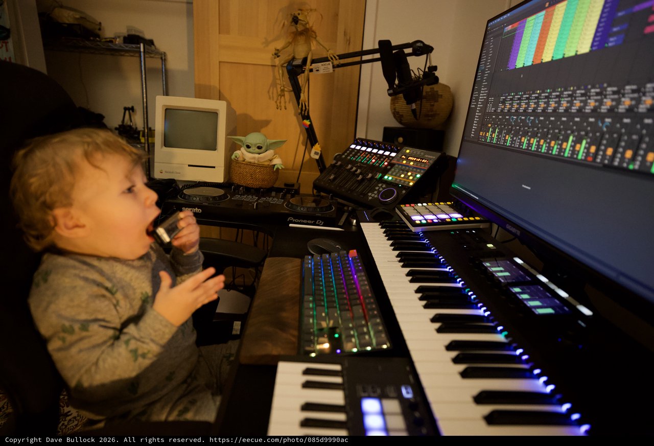 Young Child Explores Music Production Studio Setup