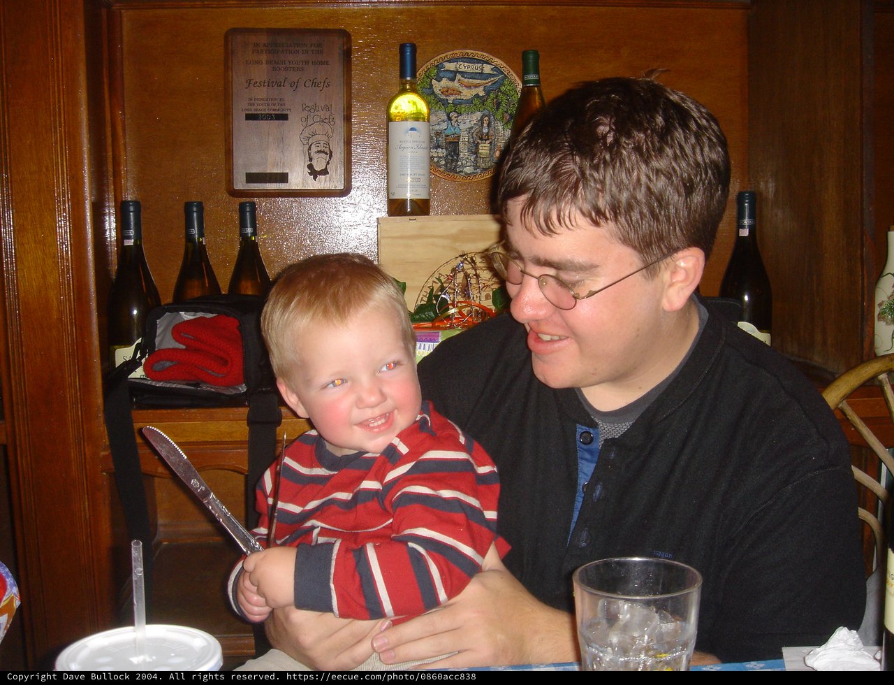 Father and Toddler Share a Joyful Restaurant Moment