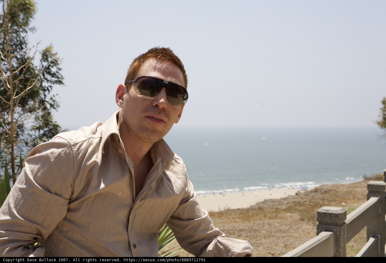 Tan-Shirted Man on the Beach