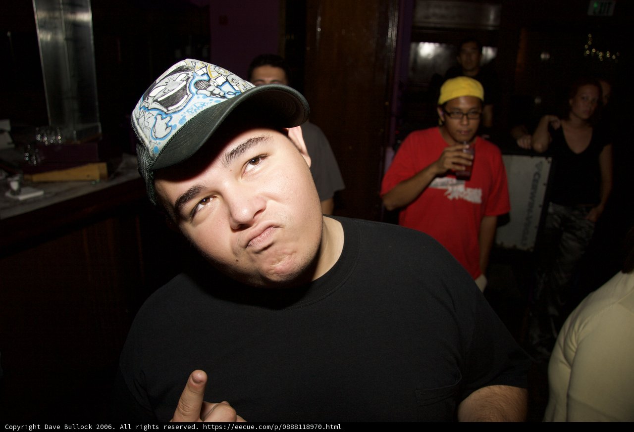 Black Shirt and Two Hats at the Pub
