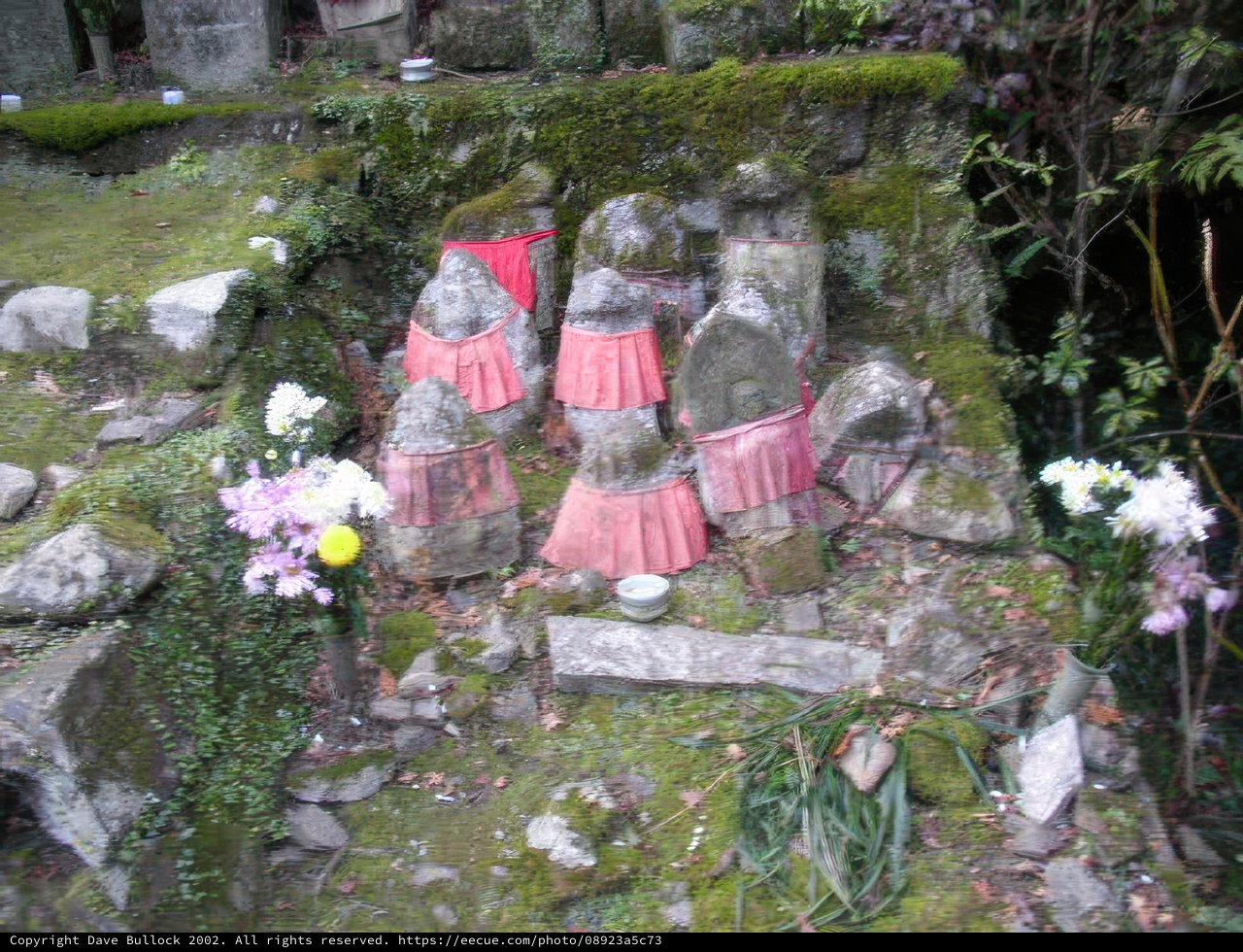 Serene Statues Amidst Blooming Beauty