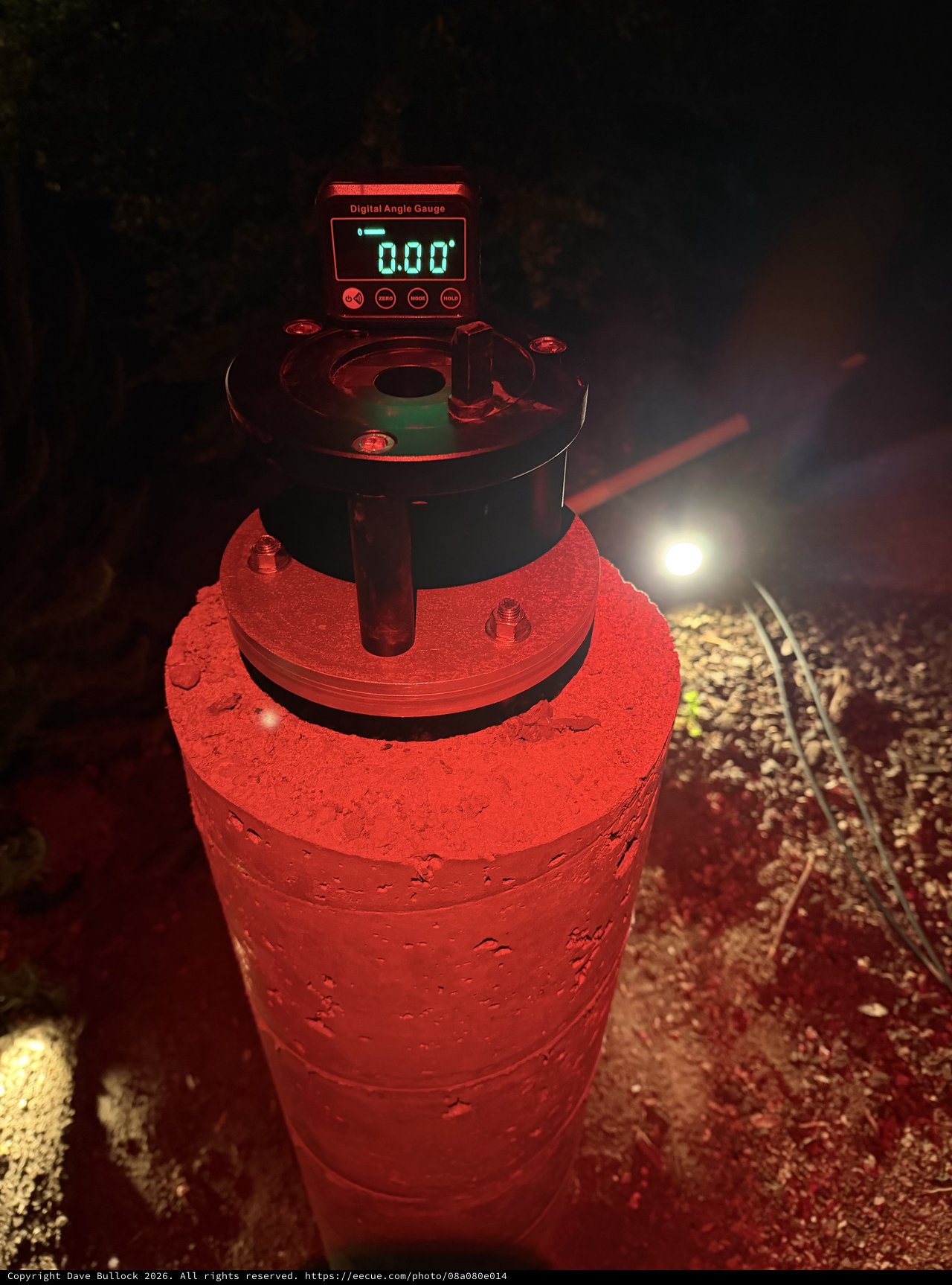 Digital Angle Gauge on Concrete Pier at Night