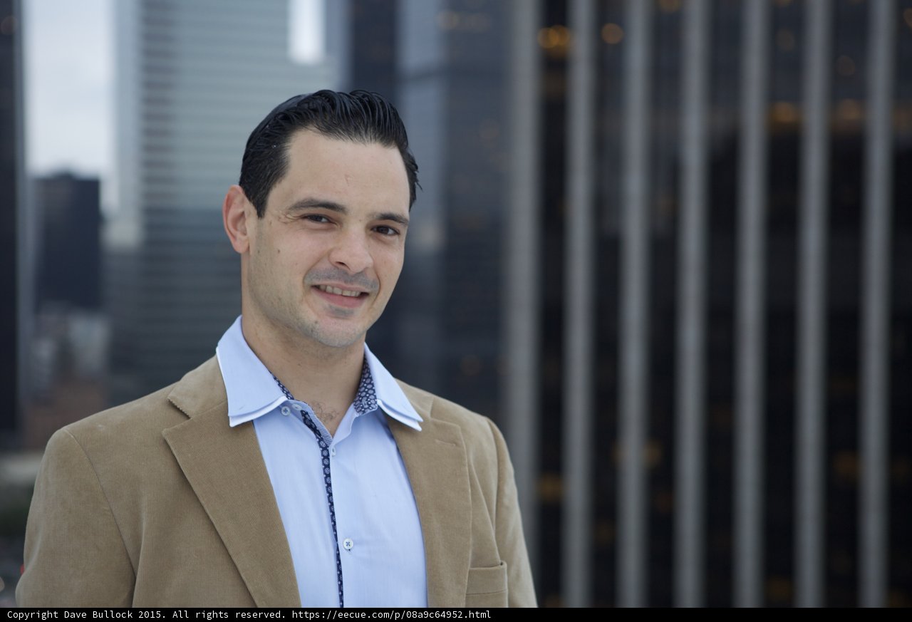 A Man with a Winning Smile against the Cityscape