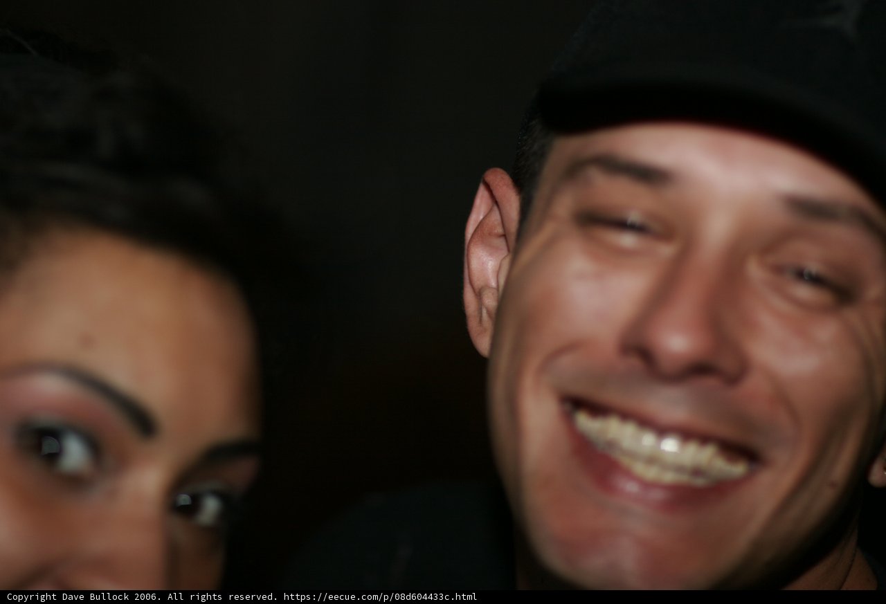 Smiling Man and Woman in Hats