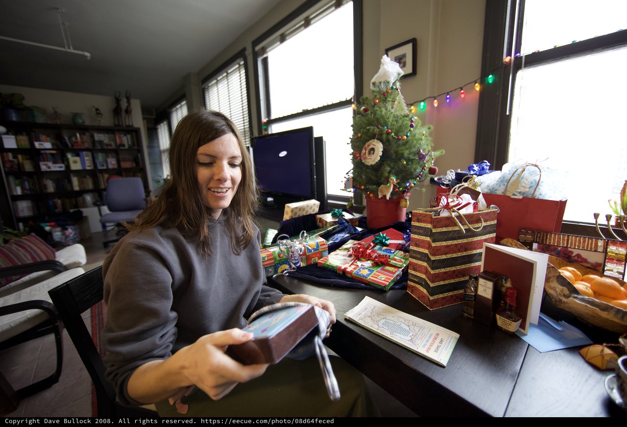 Joyful Christmas Morning Gift Unwrapping at Home