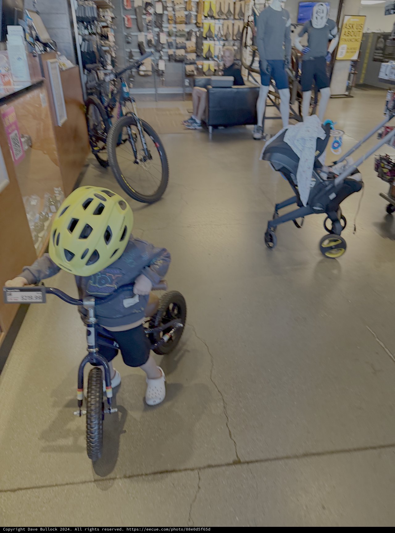 Child on Tricycle in Retail Store