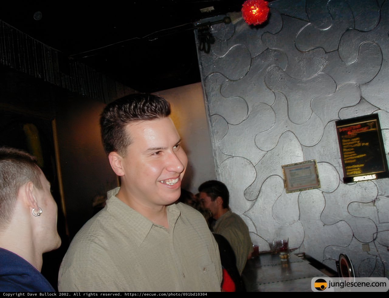 Smiling Man at Nightclub Party