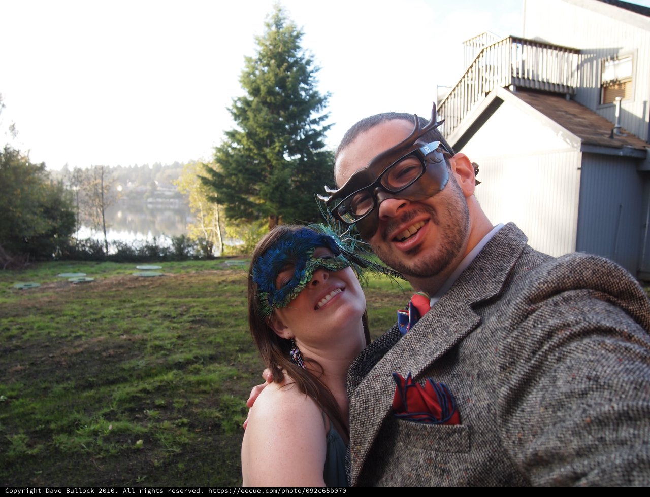 Masked Couple Selfie at Lakeside Party
