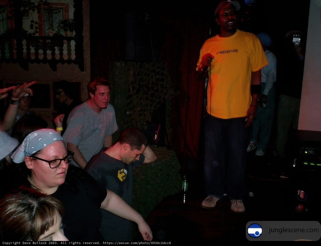 Man in Yellow Shirt Rocks Out on Stage