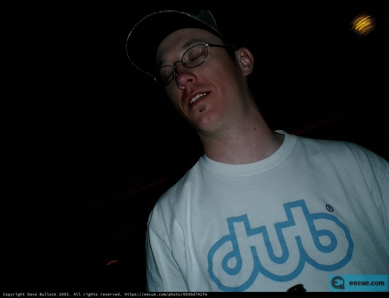 Nighttime Portrait of Andrew T in Hat and Glasses