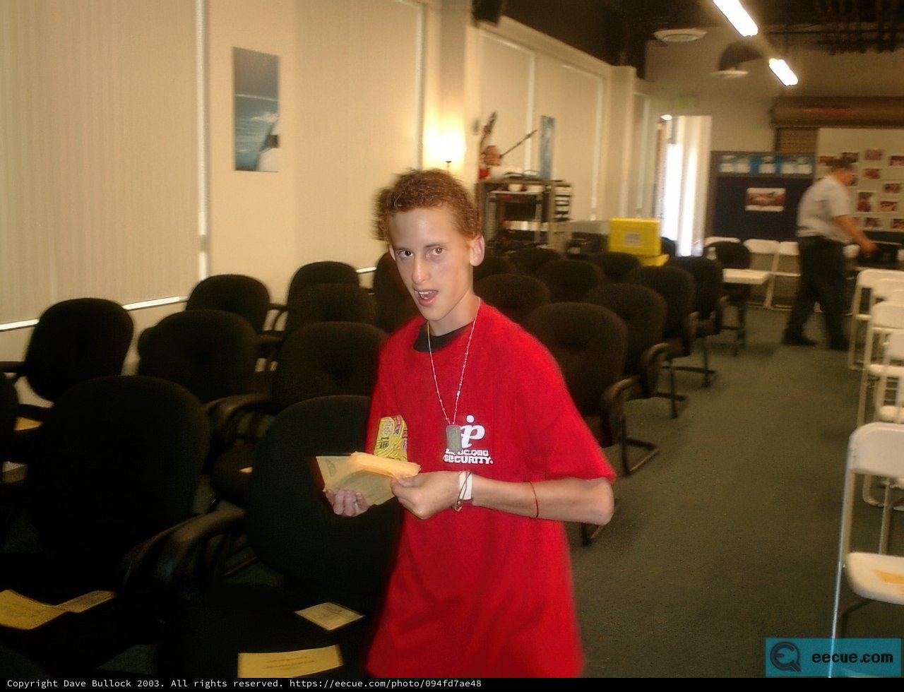 Portrait of a Young Man Holding Paper