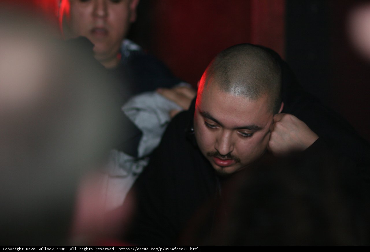 Shaved Head in the Night Club