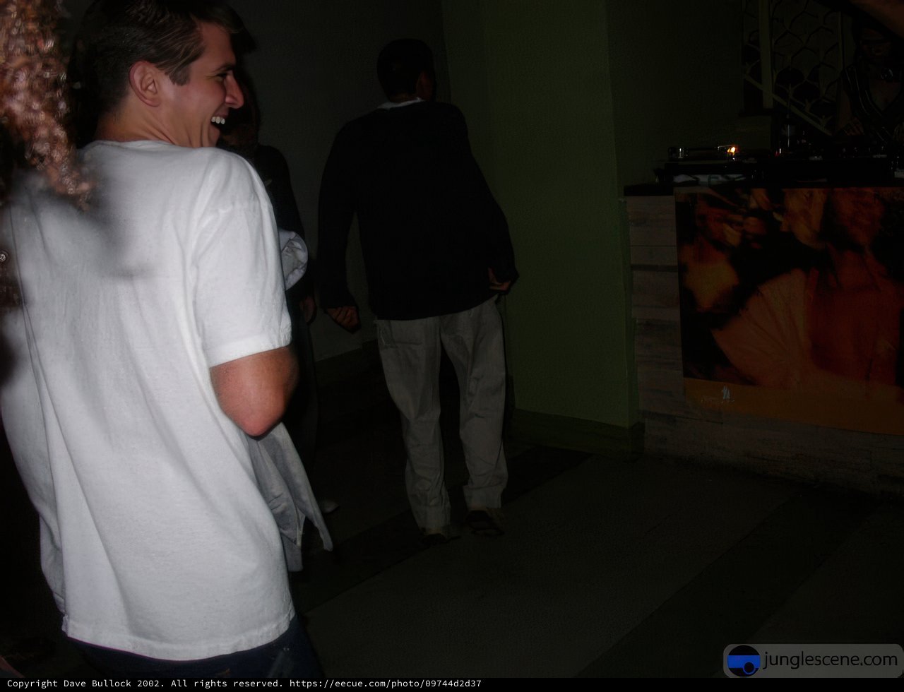 Group Gathering Around Entertainment Center