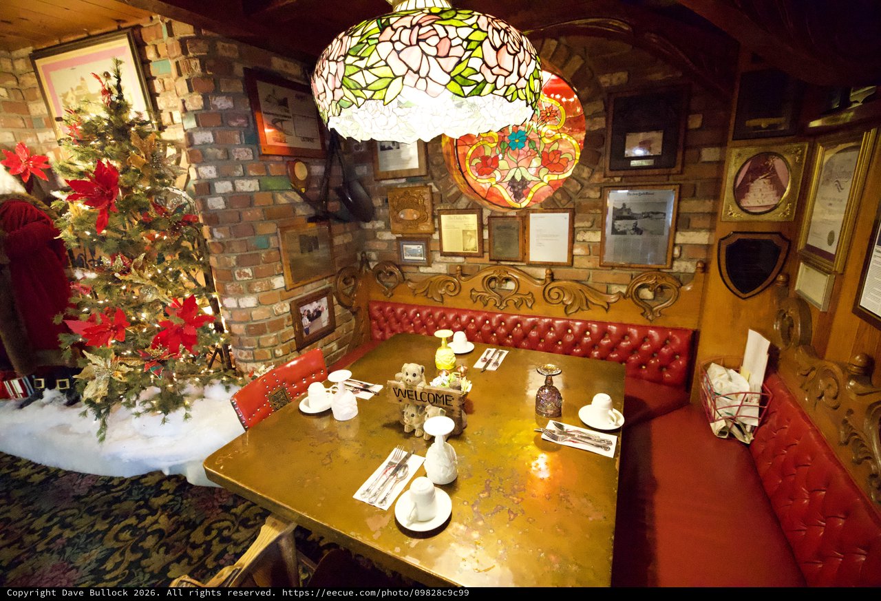 Cozy Christmas Corner with Tiffany Lamp and Red Leather Booth