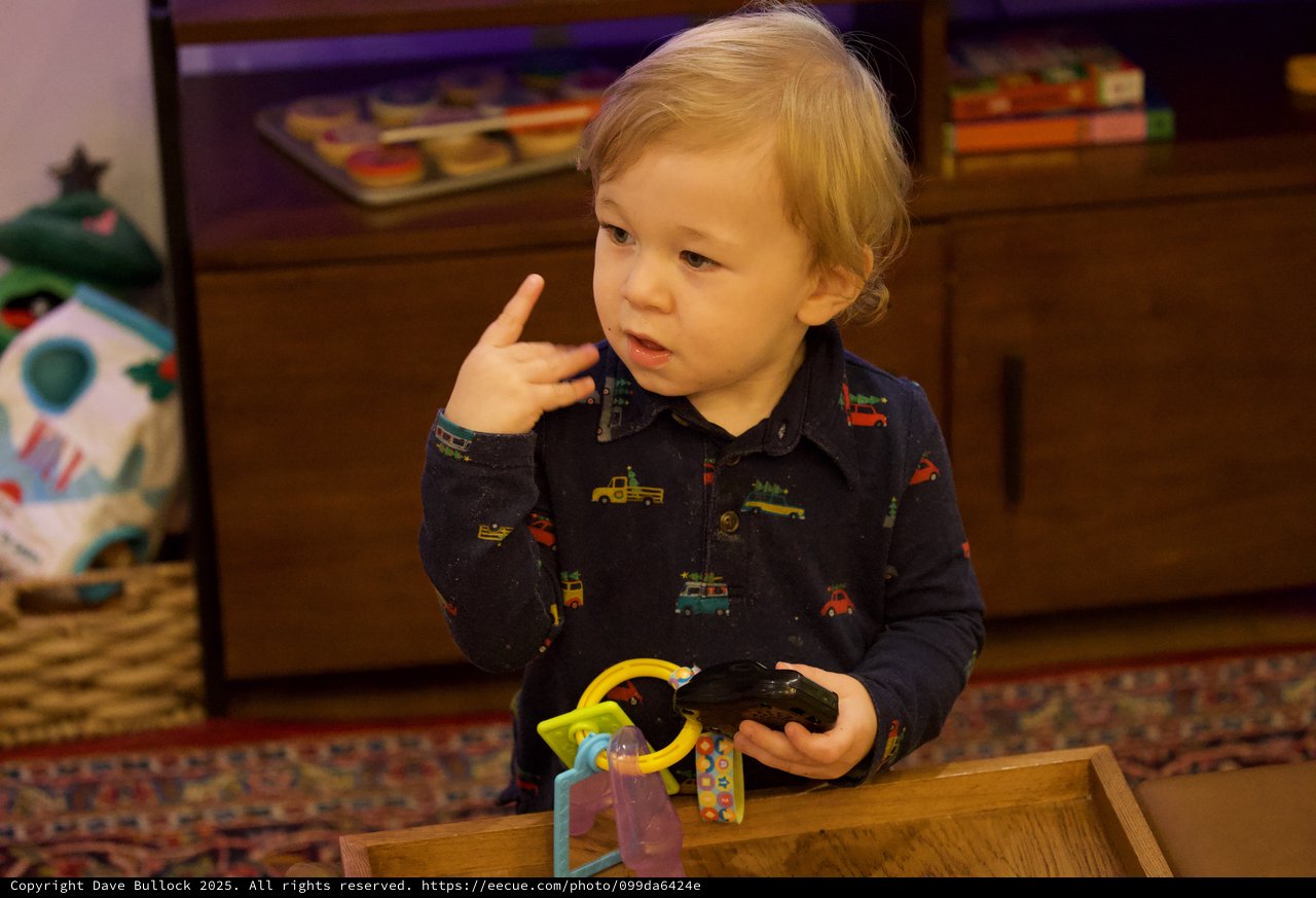 Toddler Playing with Toys on Christmas Eve