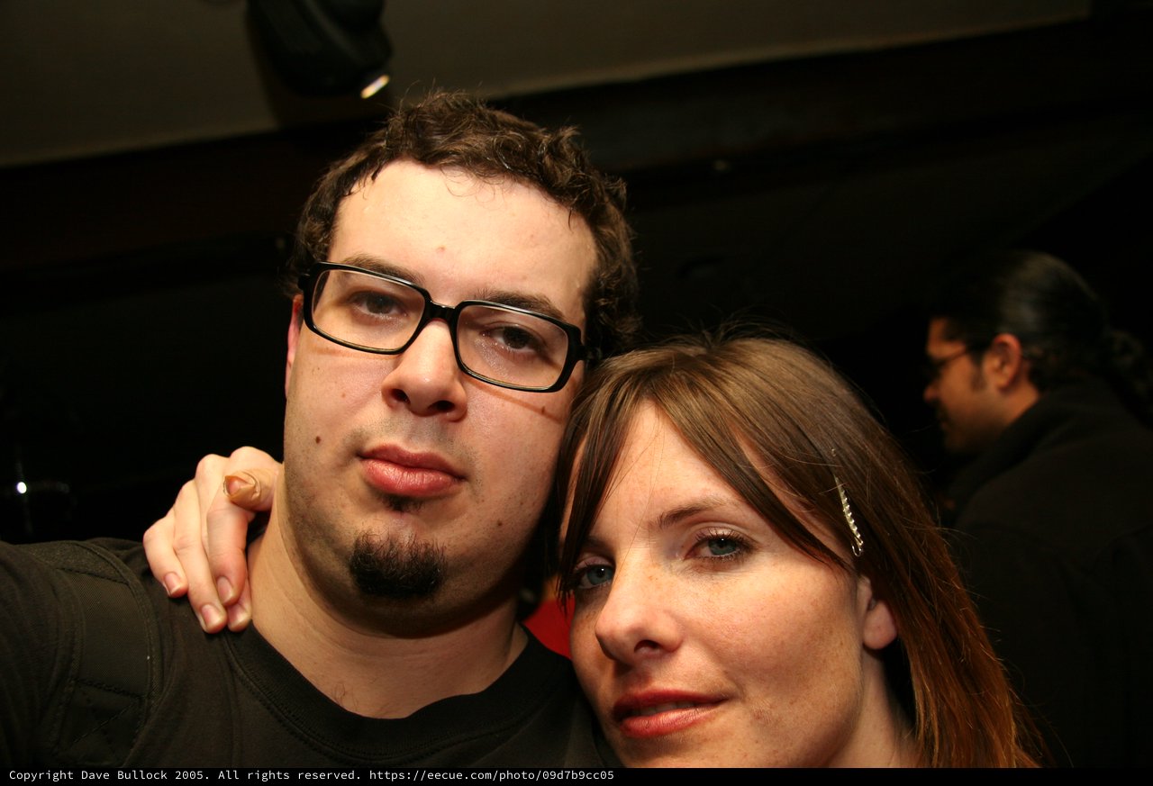 Couple Posing Together at Nighttime Social Event