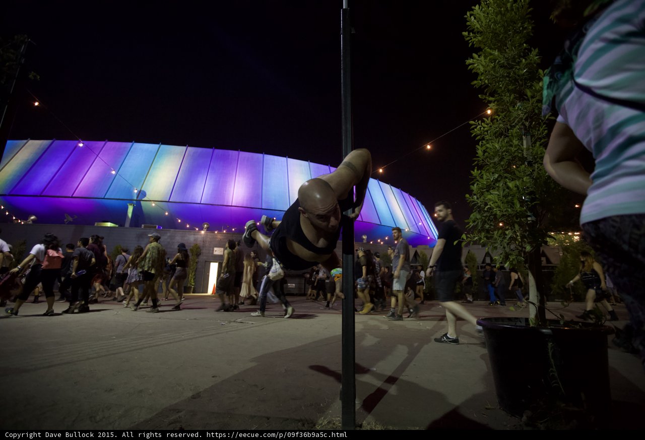 FYF Fest Bald Man Tattoo Human Flag Pole LA Sports Arena Rainbow Lights Crowd Walking Night