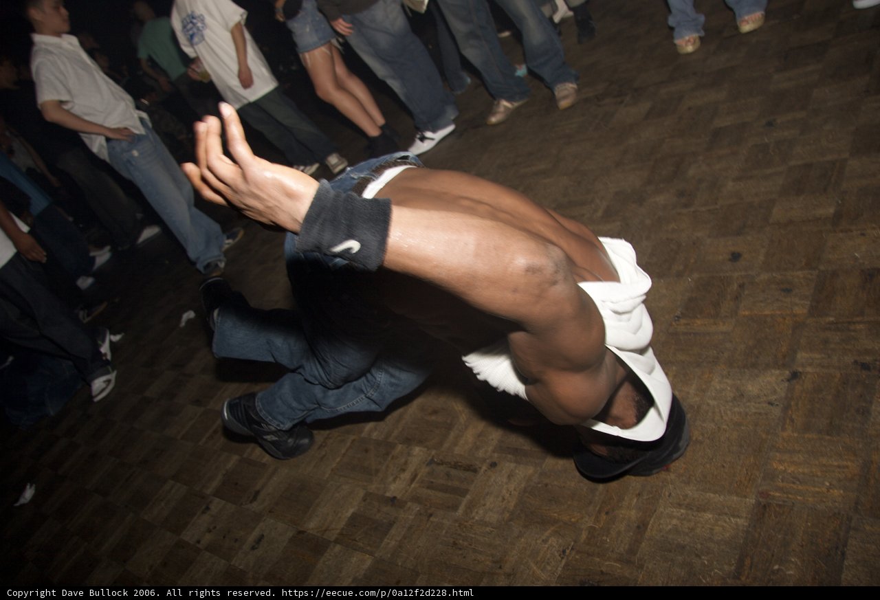 White-Shirt Breakdancing Man