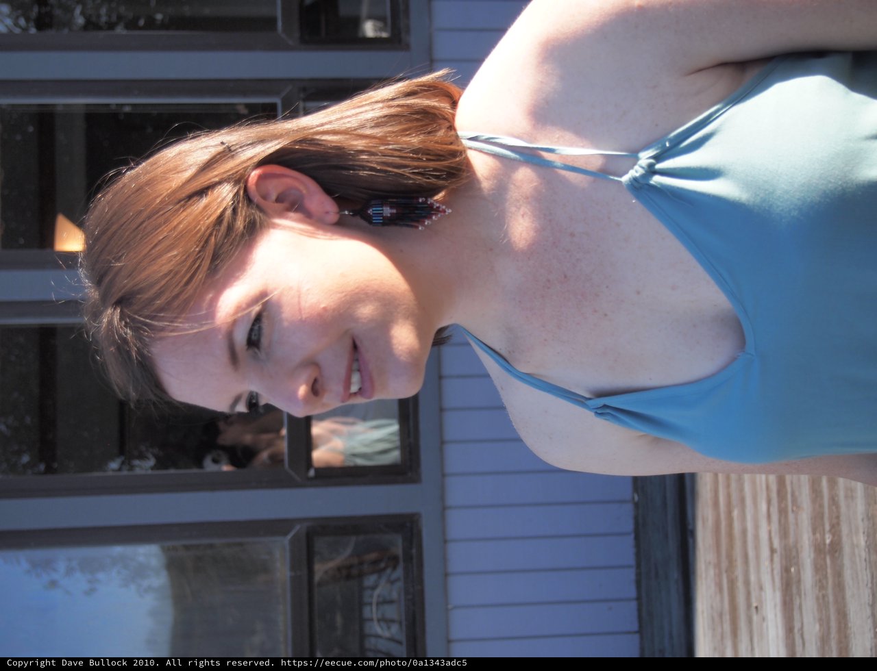 Smiling Redhead Woman in Blue Bikini Outdoors