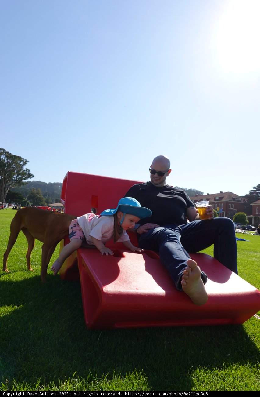 Cherished Moments: Family Time on the Red Couch