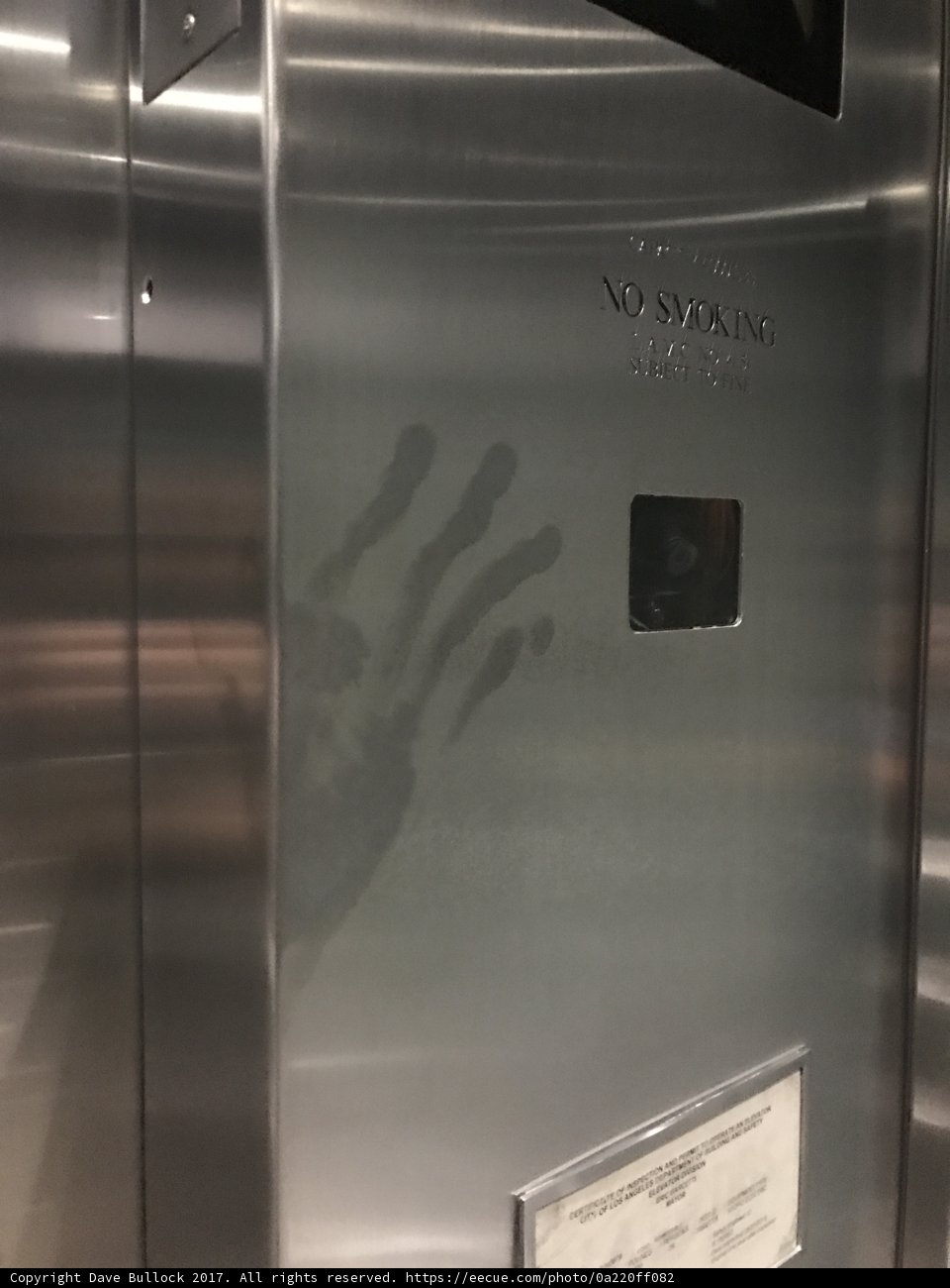 Fingerprint on a Metal Door