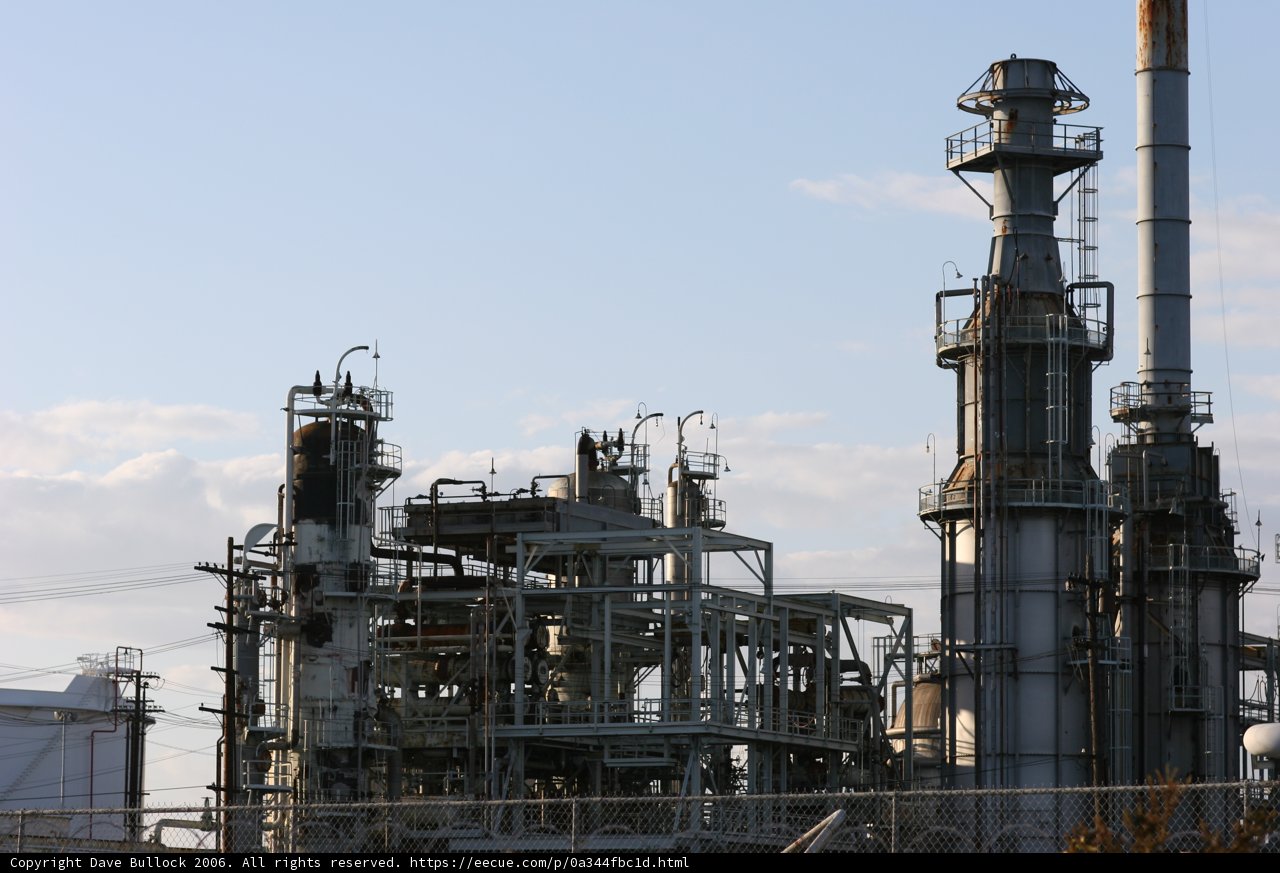 Towering Refinery in the Cloudy Sky