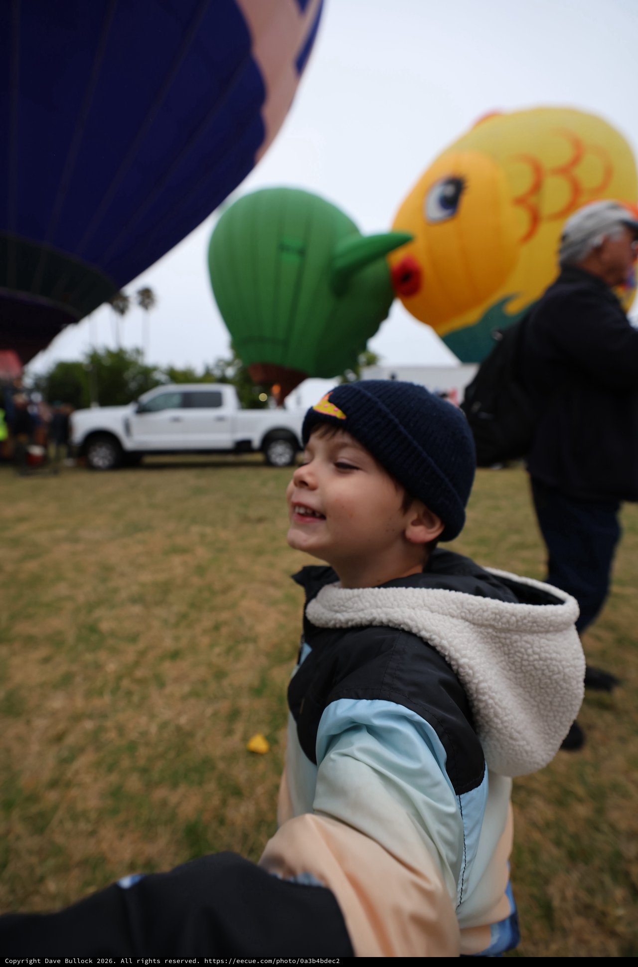 Joyful Boy Marvels at Hot Air Balloon Festival