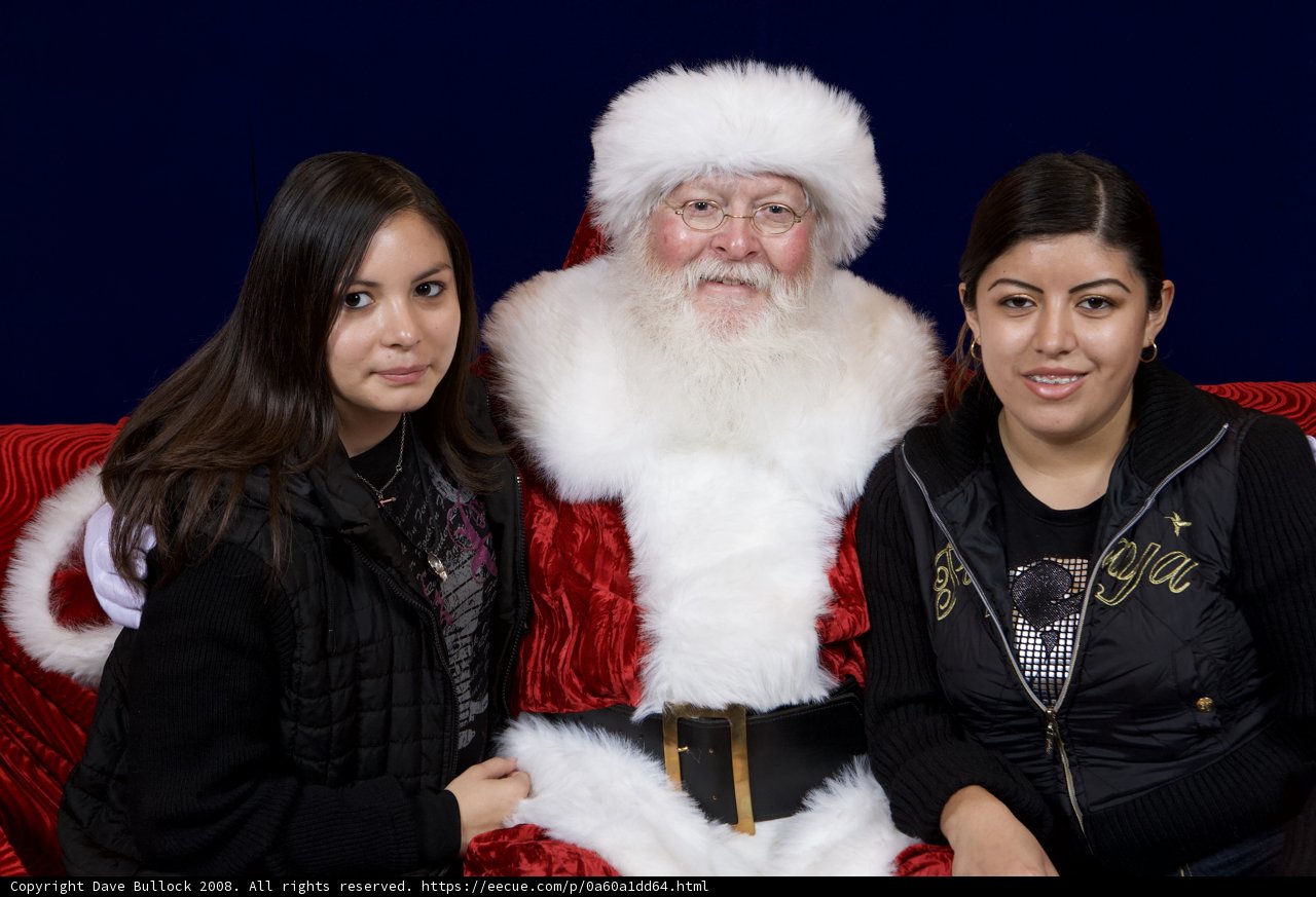 Santa Claus and Two Girls Celebrate Christmas