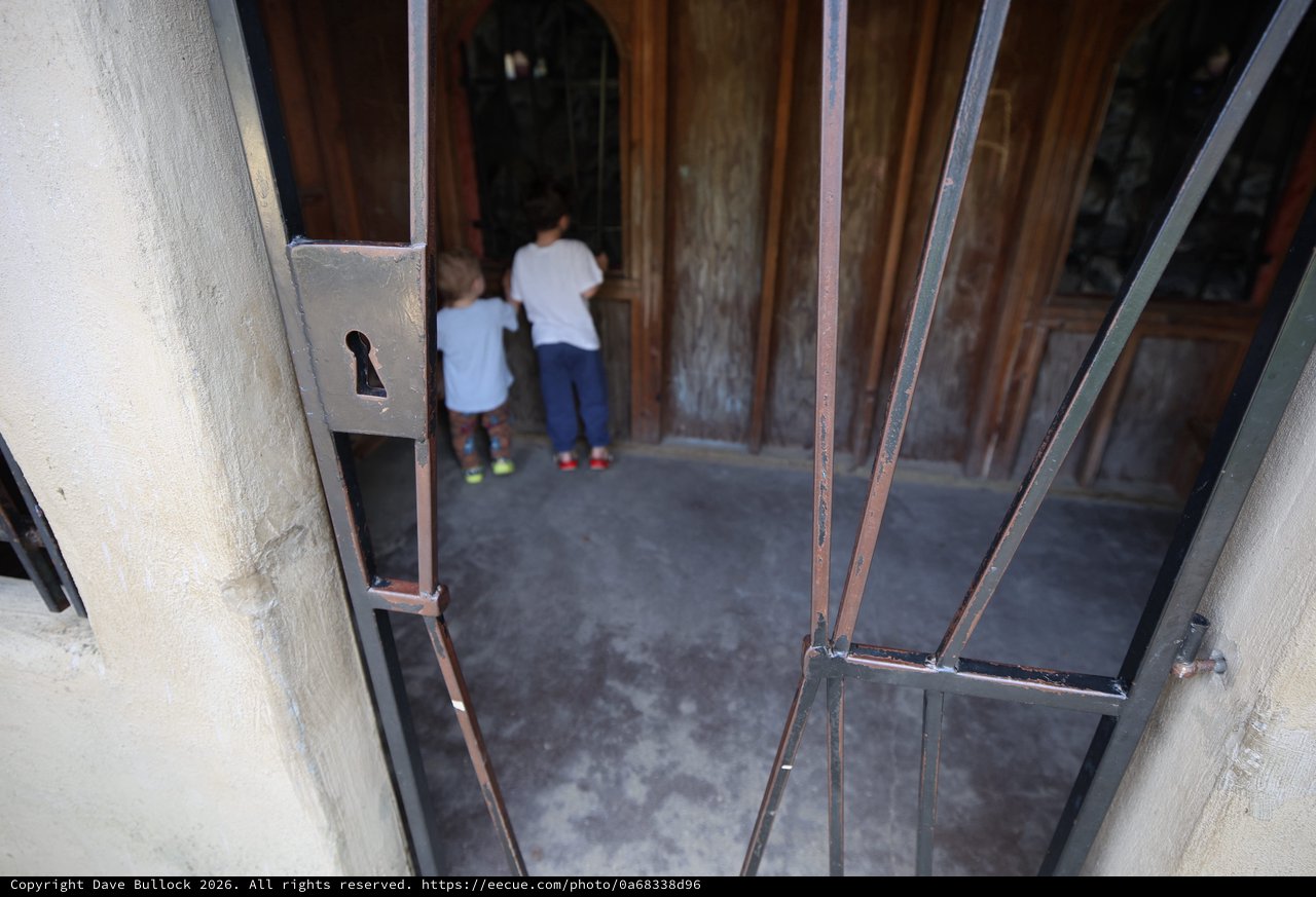 Children Entering Through Historic Church Doorway