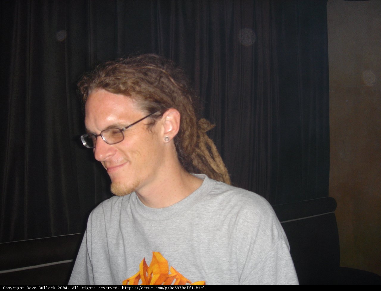 Portrait of a Man with Dreadlocks and Glasses